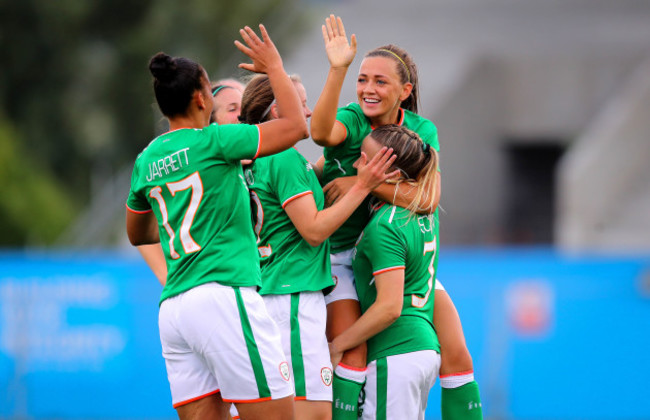 Katie McCabe celebrates scoring with her teammates