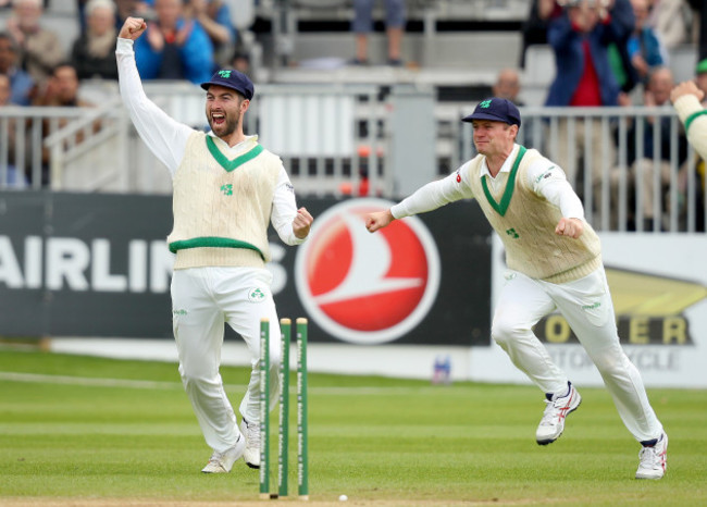 Andrew Balbirnie and William Porterfield celebrate the dismissal of Asad Shafiq bowled by Tim Murtagh