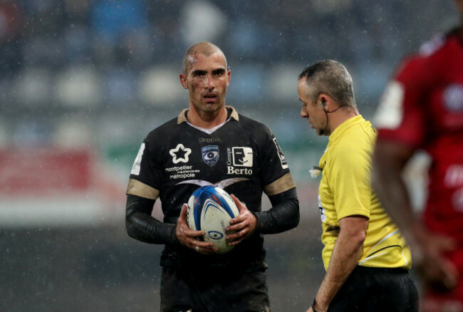 Montpellier's Ruan Pienaar with referee John Lacey