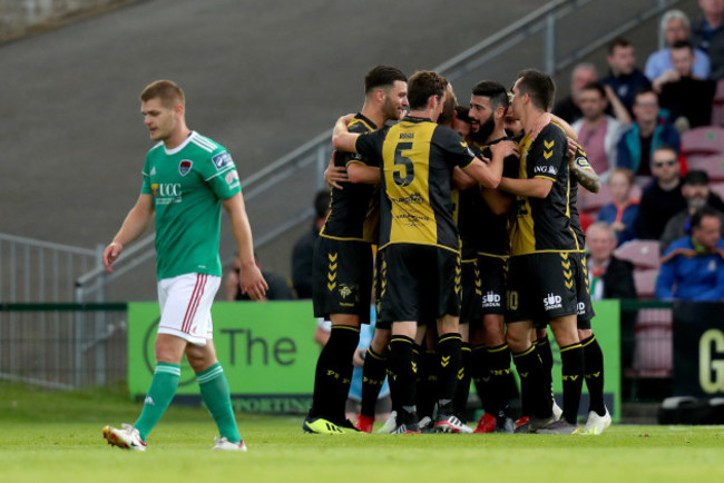 Mayron De Almeida celebrates scoring a penalty with team mates