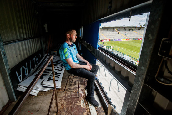 Scoreboard assistant Conor Flahive awaits the start of the game