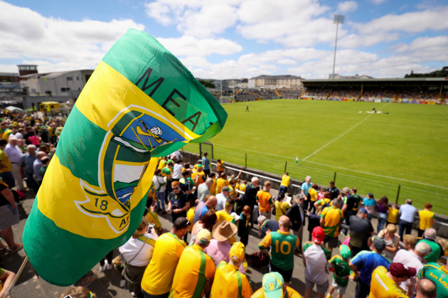 A Meath flag is raised in the crowd