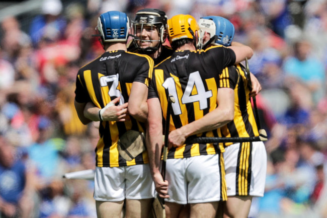 Huw Lawlor and Colin Fennelly celebrate at the final whistle with teammates