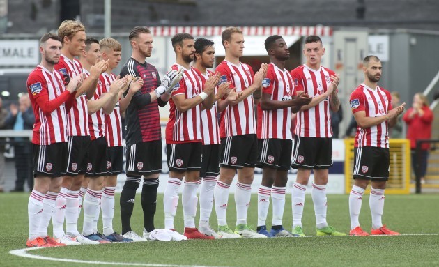 Derry players during the minute's applause in memory of former player Matt Doherty