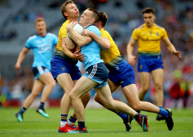 Niall Daly and Sean Mulloory tackle Con O’Callaghan
