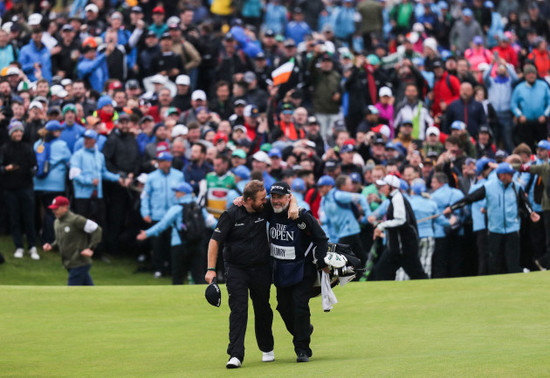 Shane Lowry celebrates winning with Brian Martin