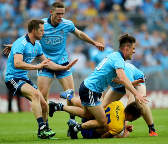 Dean Rock, Brian Fenton, Eric Lowndes and Paddy Small tackle Enda Smith