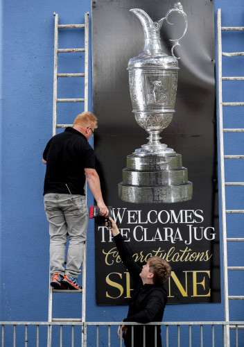 Workers erect signs commemorating Shane Lowry's win 23/7/2019