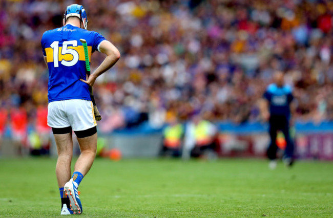 John McGrath leaves the pitch after being sent off