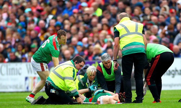 Jason Doherty leaves the field injured