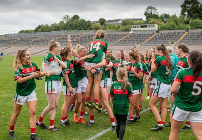 Sarah Rowe celebrates with team mates after the game