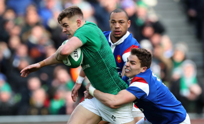 Ireland’s Garry Ringrose is tackled by France’s Gaël Fickou and Antoine Dupont