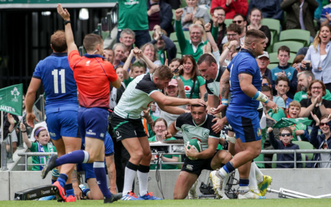 Dave Kearney celebrates scoring a try with Jordan Larmour and Tommy O’Donnell