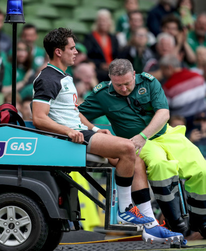 Joey Carbery is checked out by the medical staff after being taken off