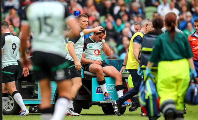 Andrew Conway consoles Joey Carbery as he leaves the field with an injury