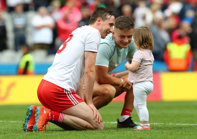 Colm Cavanagh and his daughter Chloe with Michael McKernan after the game