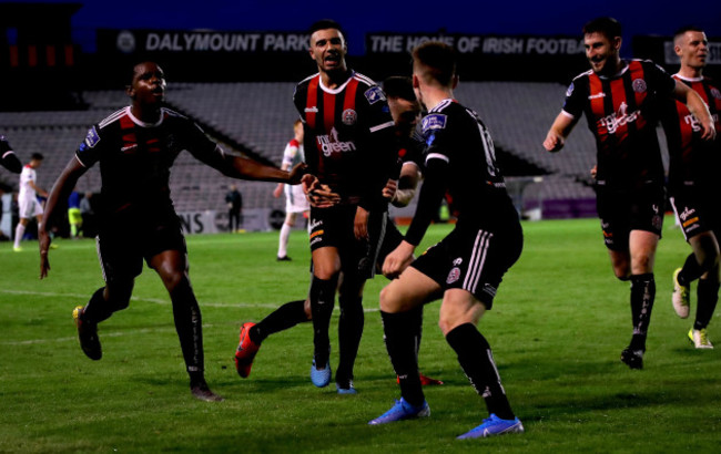 Daniel Mandroiu celebrates scoring his side's third goal with his teammates