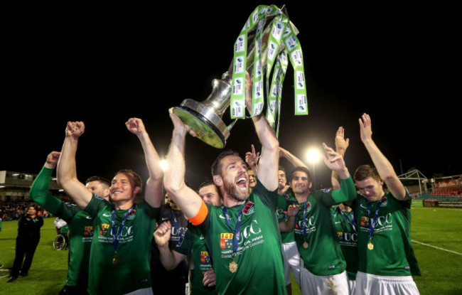 Alan Bennett raises the trophy to the Cork fans with his teammates