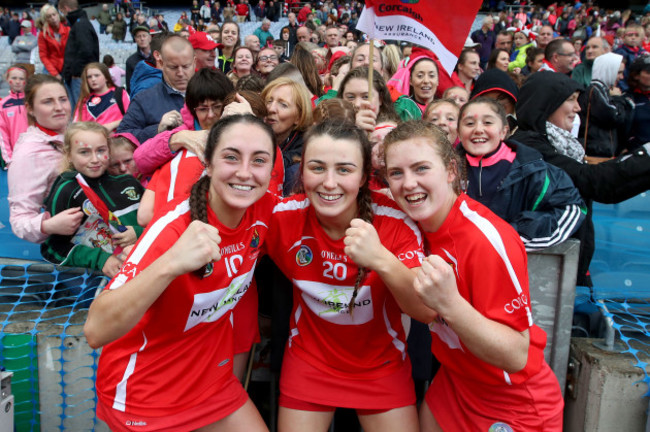 Amy O'Connor, Lauren Homan and Libby Coppinger celebrate winning