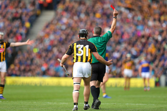 Richie Hogan receives a red card from James Owens