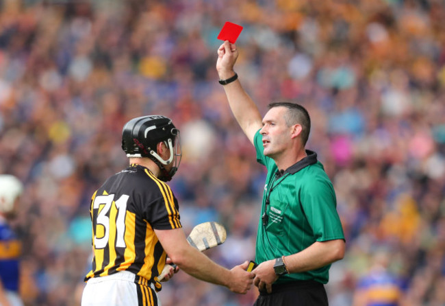 Richie Hogan receives a red card from James Owens