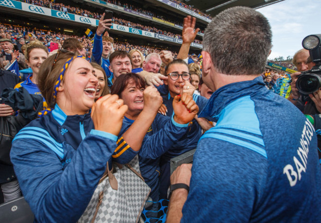 Liam Sheedy celebrates with his wife Margaret and daughters Gemma and Aislinn