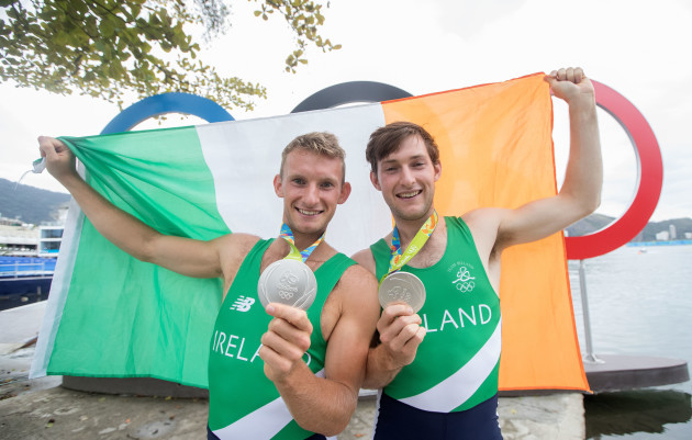 Paul and Gary O'Donovan celebrate winning a silver medal