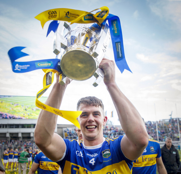 Ronan Maher celebrates with the trophy after the game