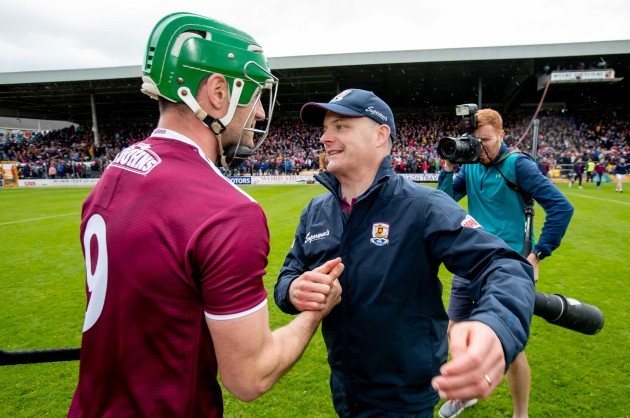 Micheal Donoghue congratulates David Burke after the game