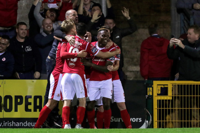 romeo-parkes-celebrates-scoring-his-sides-third-goal-with-teammates-and-a-supporter