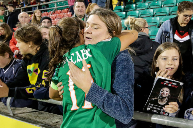 louise-quinn-celebrates-with-a-fan-after-the-game