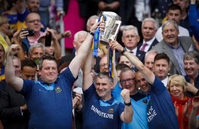 liam-sheedy-lifts-the-trophy-with-members-of-the-backroom-staff