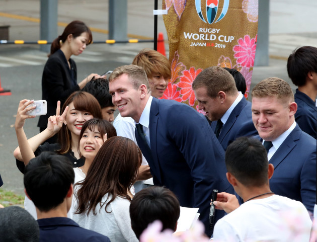 chris-farrell-akes-a-picture-with-fans-before-the-opening-ceremony