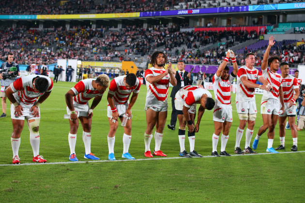 japan-players-bow-to-the-crowd-after-the-game