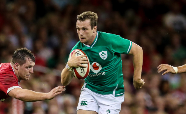 irelands-jack-carty-is-tackled-by-wales-ryan-elias