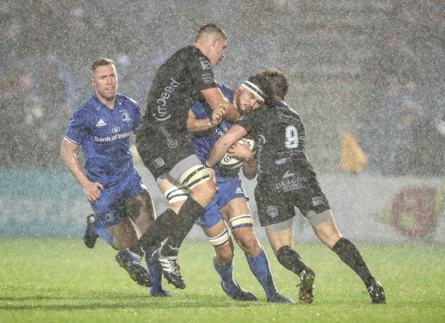 caelan-doris-is-tackled-by-leon-brown-and-rhodri-williams