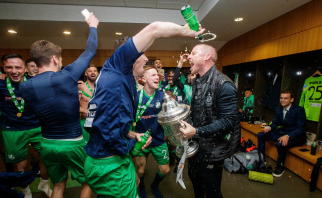 rovers-celebrate-with-the-trophy-in-the-dressing-room