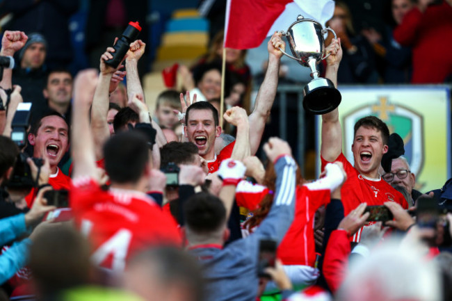 niall-carty-and-ronan-daly-lift-the-championship-cup