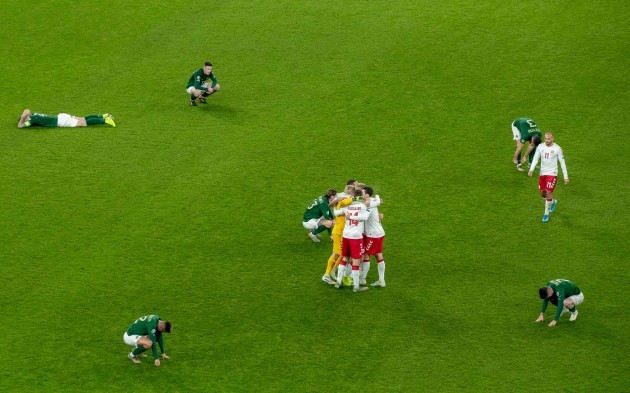 danish-players-celebrate-the-final-whistle-as-republic-of-ireland-players-fall-to-the-ground-around-them
