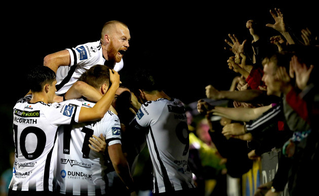 michael-duffy-celebrates-scoring-his-sides-third-goal-with-his-teammates