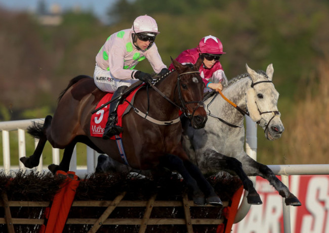 sharjah-ridden-by-patrick-mullins-and-and-petit-mouchoir-ridden-by-rachel-blackmore-jump-the-last-fence