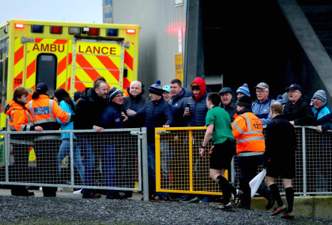 alan-coyne-is-escorted-off-the-pitch-after-the-game