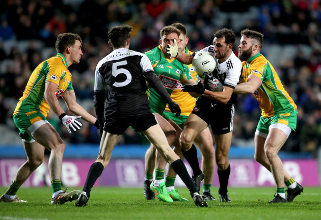 aidan-branagan-is-tackled-by-conor-cunningham