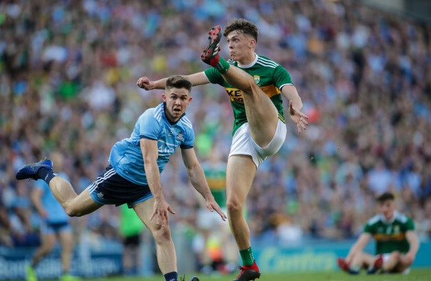 kerrys-david-clifford-scores-a-point-past-dublins-david-byrne