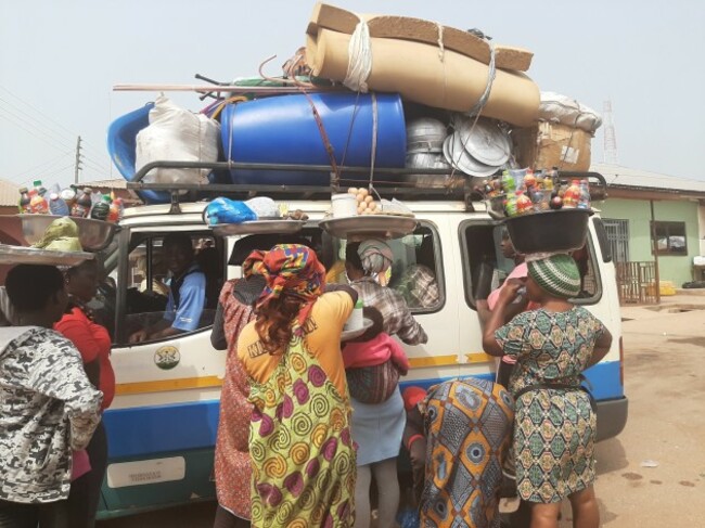 rsz_streetlife_in_ghana_is_busy_-_taxi_with_people_selling_products_while_it_stops