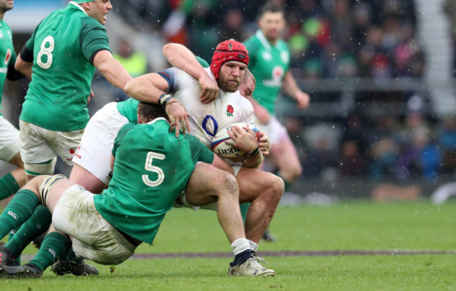 englands-james-haskell-is-tackled-by-irelands-iain-henderson-and-jack-mcgrath