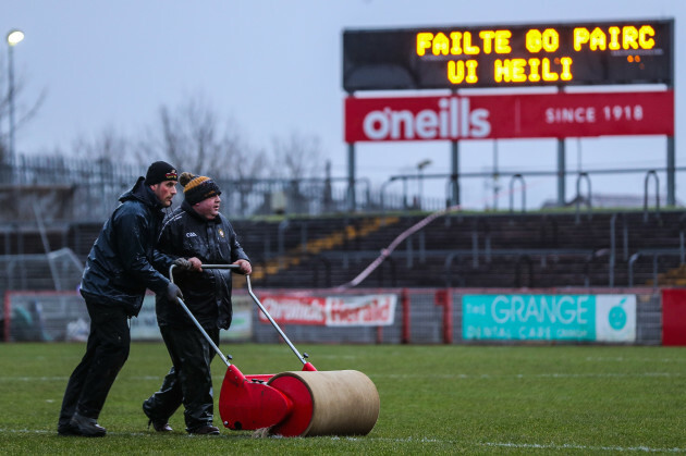 staff-at-healy-park-attempt-to-prepare-the-pitch-ahead-of-the-game