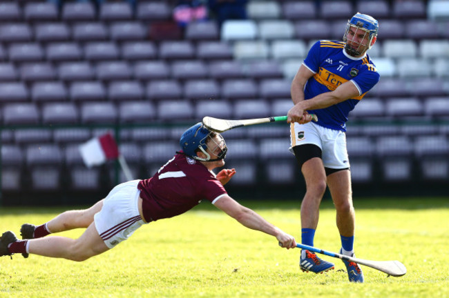 john-mcgrath-scores-a-goal-as-paul-killeen-attempts-to-block