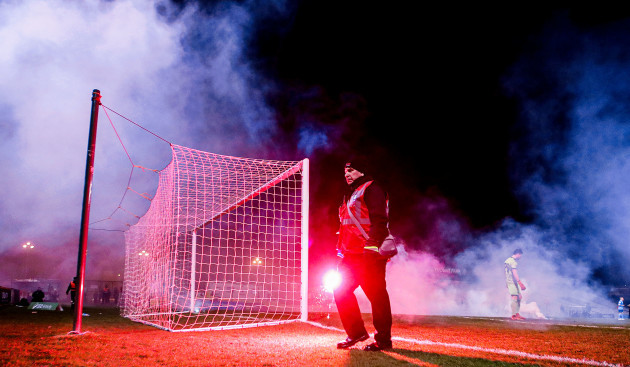dalymount-staff-remove-flares-from-the-pitch-thrown-by-fans