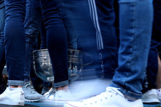 dublin-players-stand-around-the-sam-maguire-cup